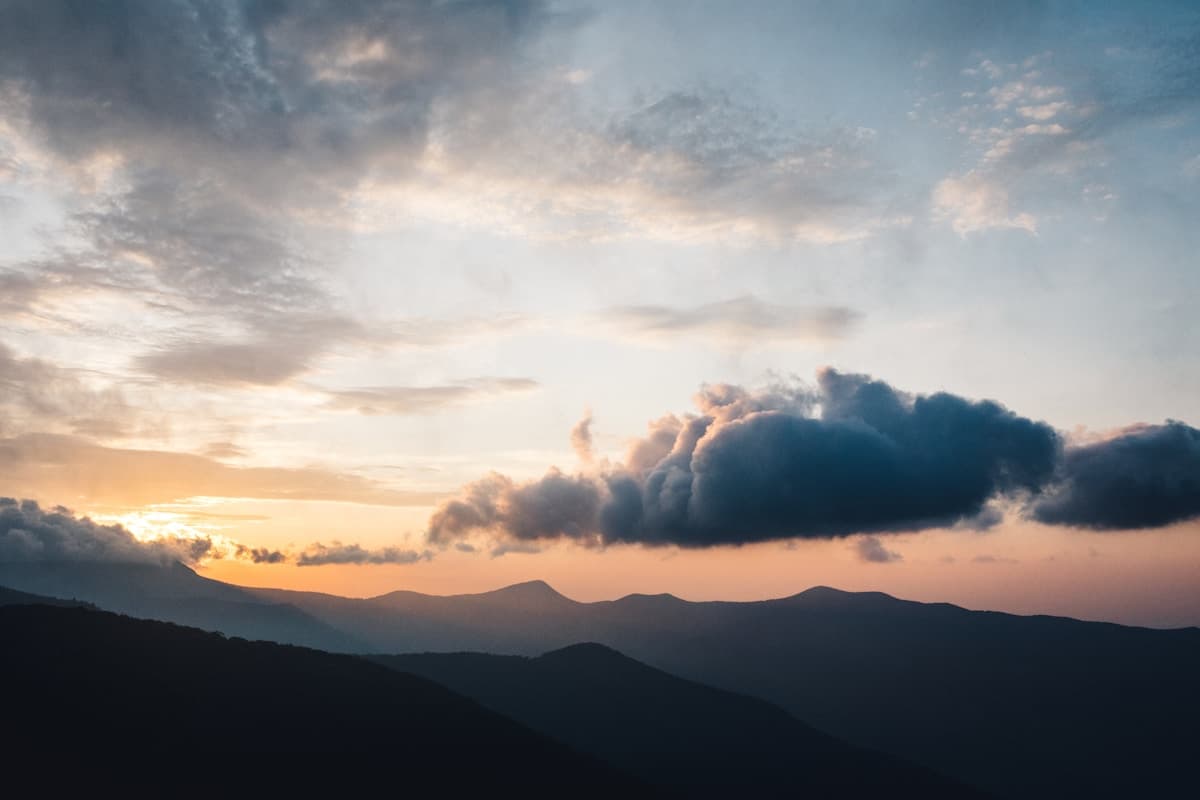 Layered mountain silhouettes — stem energies stacked into bar-graph-like quantities