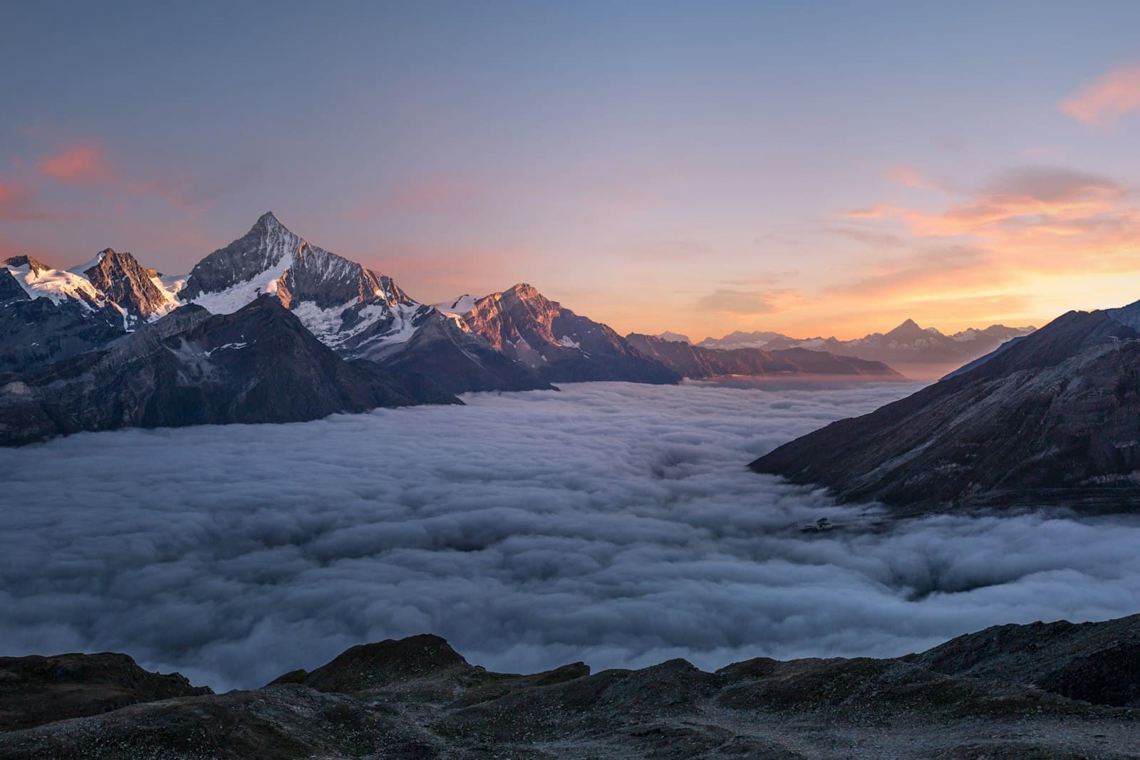 Dawn breaking over a sea of clouds — the blueprint that rises from a single birth date