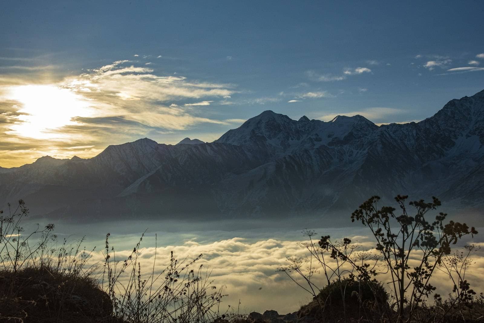 Morning sun over misty ridges — where your AI reading begins