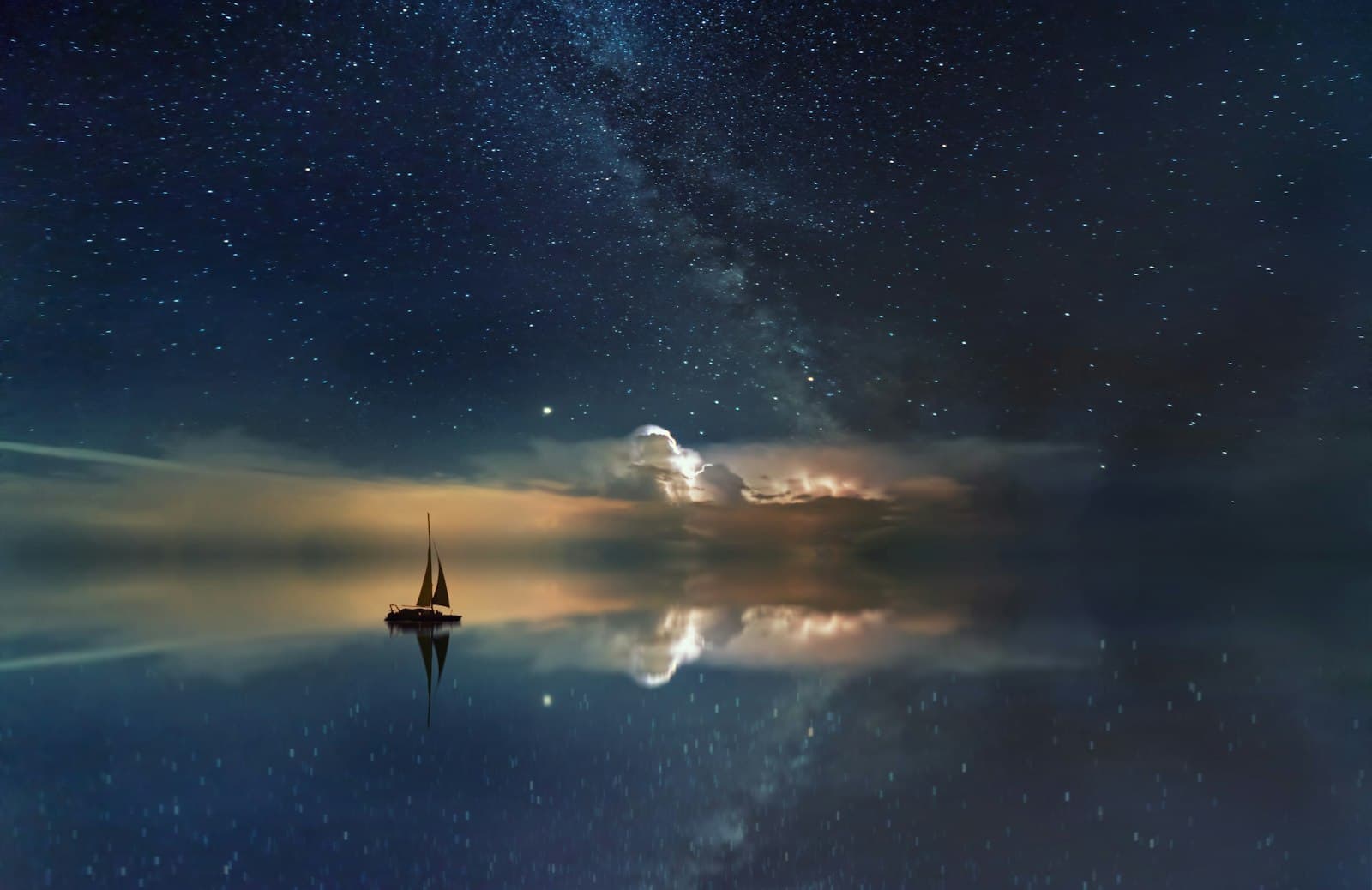 A sail gliding across star-mirrored water — steering your own course with the chart as your map